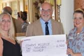 Queens Hotel general manager Catherine Austen, left, with Rowans Hospice's chair of trustees John Watkins and CEO Ruth White