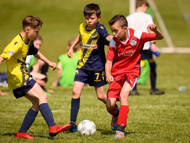 Action from the Clanfield youth football tournament at Horndean Technology College. Picture: Keith Woodland (270521-238)