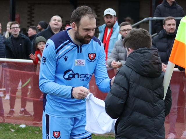 Portchester's Brett Pitman with a young spectator. Picture by Ken Walker.