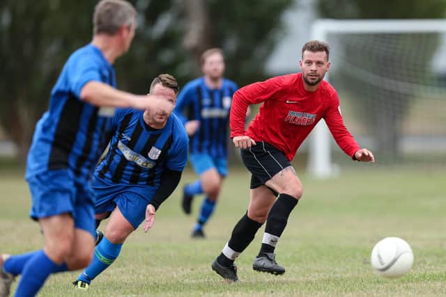 Louis McGowan, right. Wymering (in red) v Segensworth (blue and black stripes). Friendly at King George V playing fields, CoshamPicture: Chris Moorhouse    (150820-)