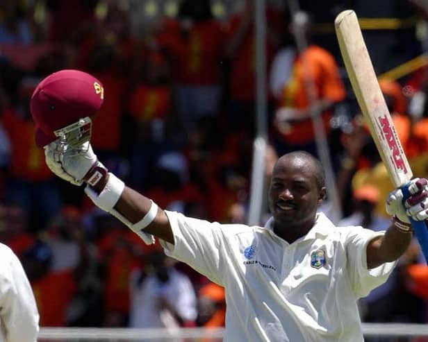 Brian Lara celebrates becoming the first man in history to score 400 in a Test innings against England in 2004. Pic: Gordon Brooks/AFP via Getty Images.