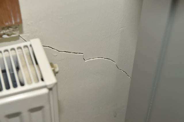 Damage to Voluptuous Vintage shop and a residential property next door in Village Road, Alverstoke, where a two-car collision took place and three people have been arrested. Pictured is: Damage to the house in Village House, Alverstoke./ppPicture: Sarah Standing (110124-4578)
