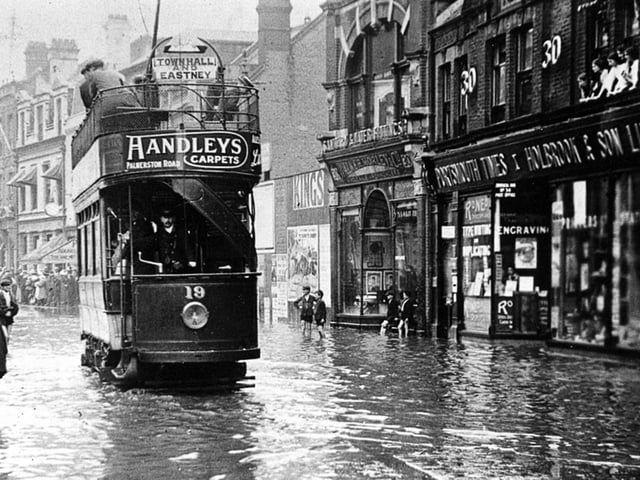 Portsmouth Corporation electric tram No 19 negotiating floods in Commercial Road  in August 1911.