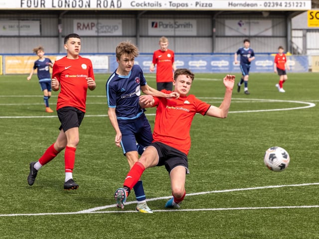 Action from the Under-14 Memorial Challenge Cup final between Pickwick Youth Pumas (all blue kit) and Horndean Youth Red. Picture: Mike Cooter