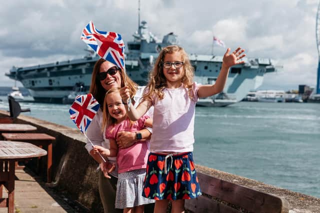 Lindsey, Lottie and Florence, eagerly awaiting the return of husband and father Commander Chris Allen who is the warfare commander on board HMS Queen Elizabeth. Photo: Royal Navy