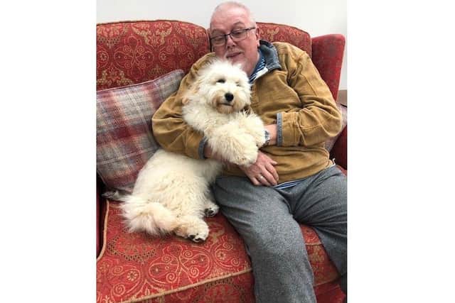 Phil Dyke, a Gosport cyclist whose life was turned upside down when he was hit by an unqualified driver and had his leg amputated, is looking to the future after a settlement has resulted in specialist adaptations to be made to his home. Pictured with new puppy Arlo