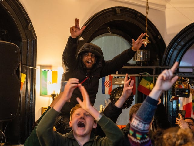 England fans celebrating Harry Kane's penalty at The Kings in Southsea. Picture: Matthew Clark