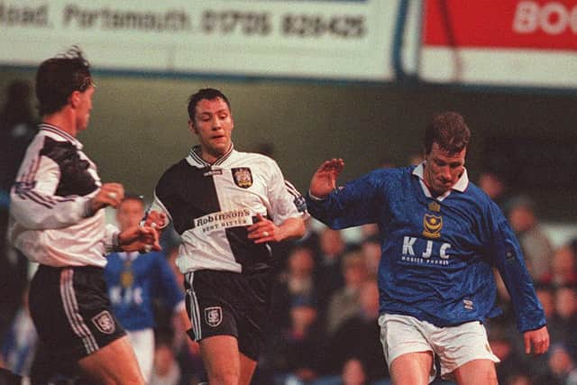 Pompey favourite Steve Claridge fends off two Stockport defenders in February 1998. Picture: Steve Reid