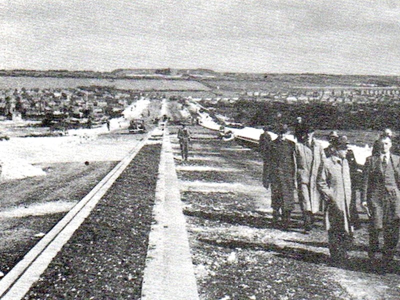 City officials walking the newly ‘completed' Eastern Road.