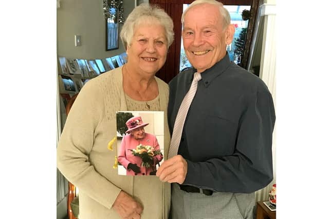 Sarah and Bob Jeffery with their card from The Queen.