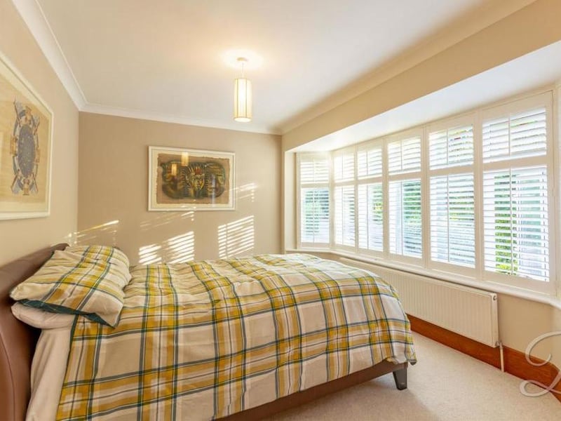 The third bedroom is super-bright, thanks to its bay window, with shutters, at the front. Presented to a high standard and carpeted, it also includes modern, fitted wardrobes.
