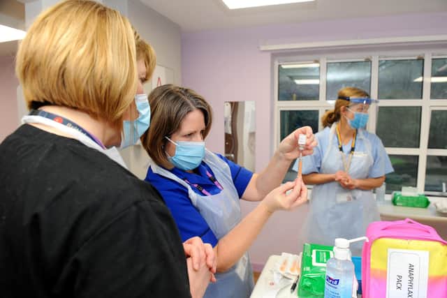 The Portsmouth NHS Covid-19 Vaccination Centre at Hamble House based at St James Hospital opened on Monday, February 1.
Pictured is: (middle) Nurse Teresa Ellis prepares the vaccination.
Picture: Sarah Standing (010221-2014)