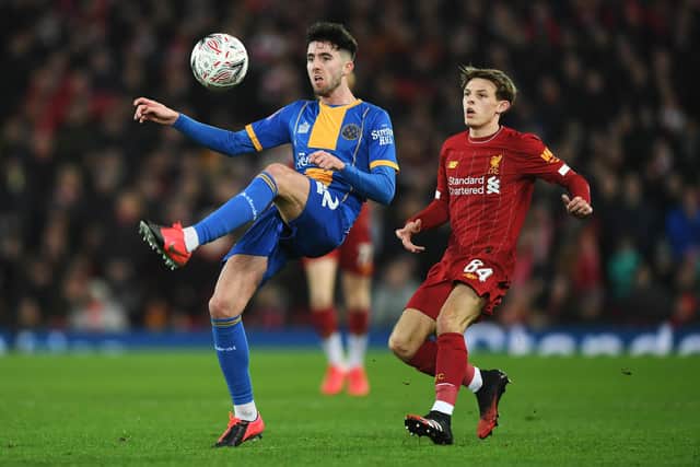 Sean Goss in action against Liverpool last year. (Photo by Gareth Copley/Getty Images)