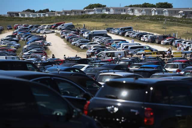 QUEUES: The main car park at Durdle Door, Dorset, earlier this week. Picture: PA