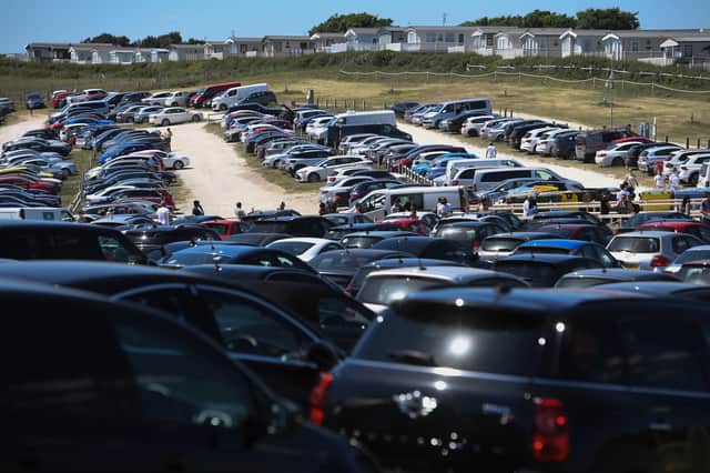 QUEUES: The main car park at Durdle Door, Dorset, earlier this week. Picture: PA
