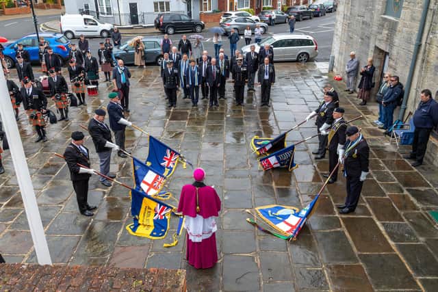 Standards were lowered while the names of the fallen were read aloud. Picture: Mike Cooter (010522)