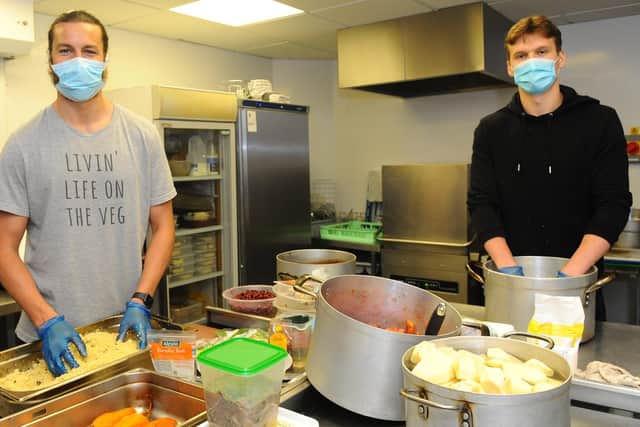 Christian Burgess and Sean Raggett volunterring at the Enable Ability cafe at Landport Community Centre. Picture: Sarah Standing (300420-8145)