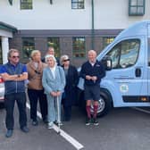Wally Shufflebottom's family present the Variety Club Sunshine Coach to The Harbour school alongside former England footballer Steve Coppell