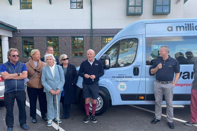 Wally Shufflebottom's family present the Variety Club Sunshine Coach to The Harbour school alongside former England footballer Steve Coppell