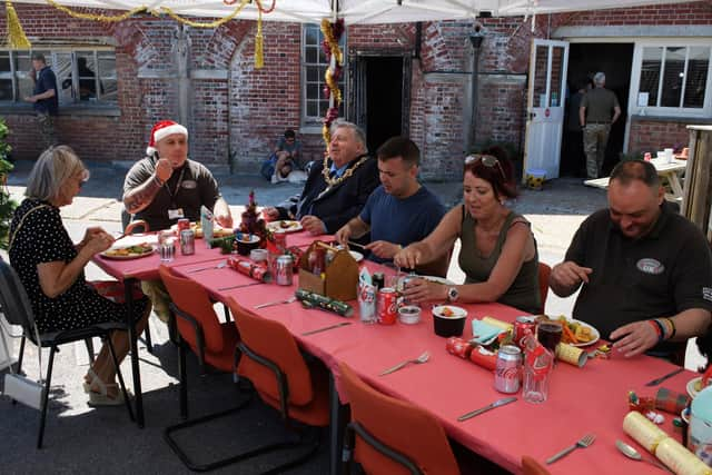 Pictured is: Lord and Land Lady Mayoress sit down for their Christmas meal with some of the veterans and volunteers. Picture: Keith Woodland (050621-16)