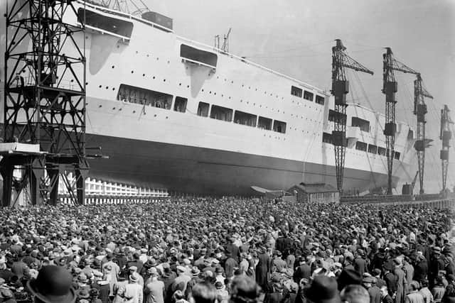 Huge crowds watch as the 22,000-ton aircraft carrier HMS Ark Royal (91) is launched at the Cammell Laird shipyard in Birkenhead, on April 13, 1937. The ship was later sunk off Gibraltar by the German submarine U-81 in November 1941. Picture: Hulton Archive/Getty Images.