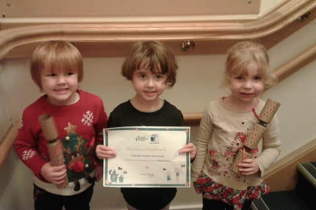 Tops Day Nurseries children celebrate its green flag status.