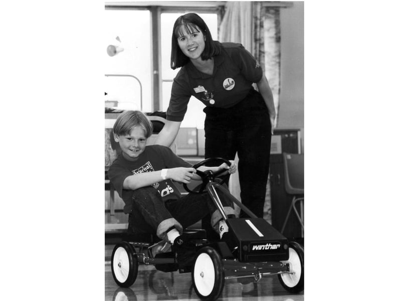 Adam Easton on one of the new pedal cars in June 1994