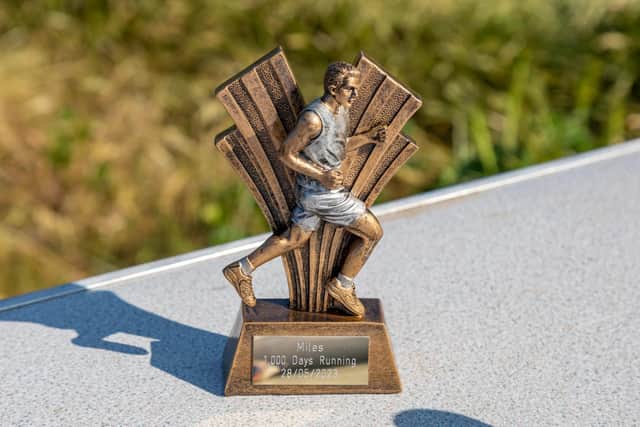 A trophy presented to Miles van der Lugt for reaching his 1,000-day running streak. Picture: Mike Cooter