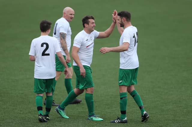 Harry Potter (second right) celebrates his hat-trick goal against FC Strawberry. Picture: Dave Haines.