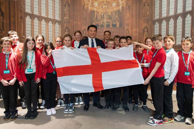 Pupils from Trosnant Junior School with Alan Mak MP during their visit to Parliament