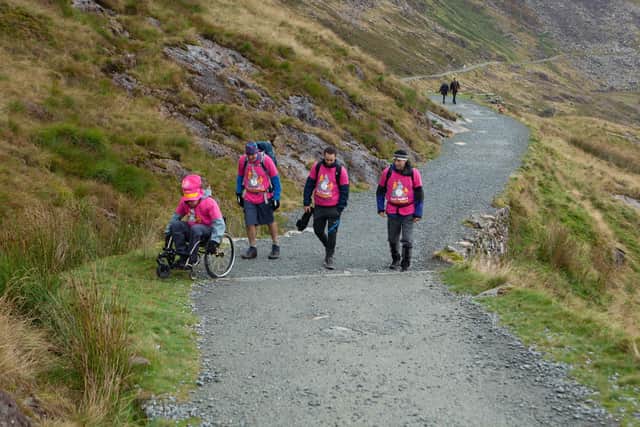 Paul Smith and his team ascending Snowdon.Credit: Karen Morling