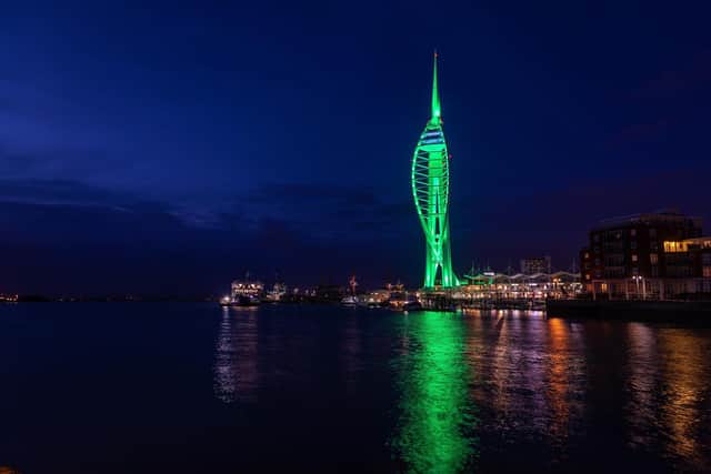 The Spinnaker Tower lights turn green for International Phelan-McDermid Syndrome Awareness Day. Picture: Mike Cooter (221022)