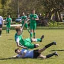East Lodge's Olly Martin (white) makes a tackle during his side's 2-2 draw with Carberry. Picture: Mike Cooter.