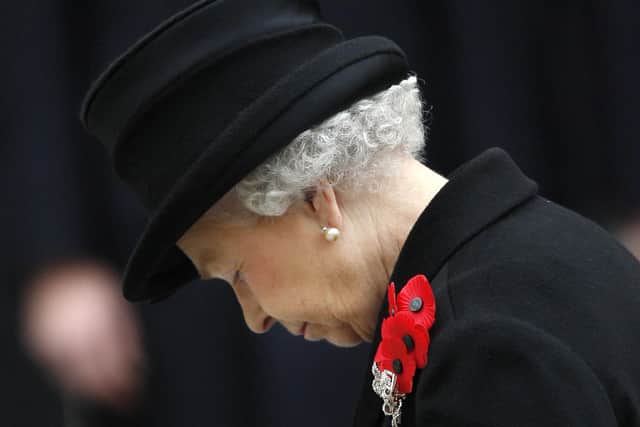 Queen Elizabeth II listens to a prayer during the Remembrance Sunday service at The Cenotaph in London (photo: Adrian Dennis/AFP via Getty Images)