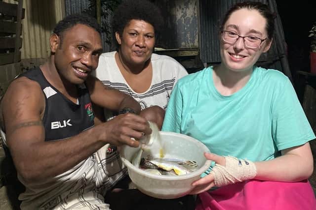 Left to right: Vatemo Ravouvou Jnr, Adivula Batiribalavu and Bobby Gould with freshly caught fish.