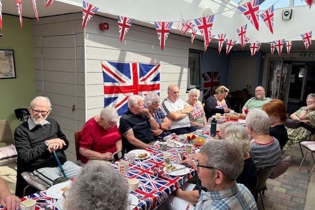 Residents from the retirement flats get together for a street party