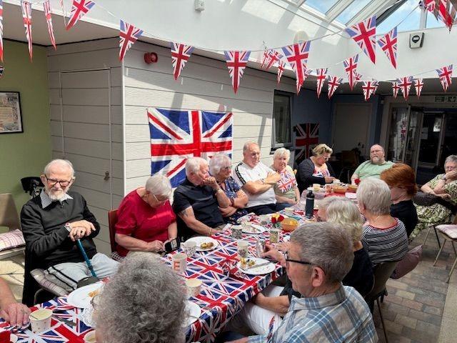 Residents from the retirement flats get together for a street party