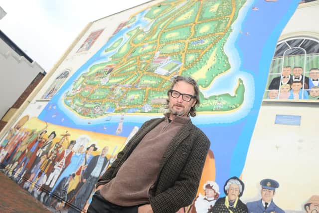 Artist Mark Lewis pictured in front of the Strand mural.
Picture: Sarah Standing (171120-8684)