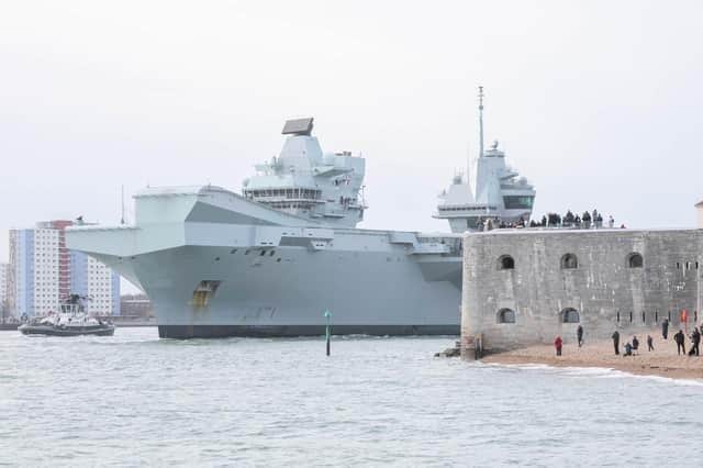 A News archive photo shows HMS Queen Elizabeth passing the Hot Walls in Old Portsmouth - a sight that residents won't have for a while as the Royal Navy flagship completes exercises of the USA coastline before deploying to the Mediterranean Sea.