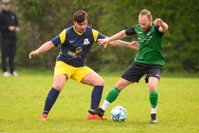 Action from Saturn Royale's 1-0 win over Pelham Arms (blue and yellow) in the Adelaide Cup semi-final. Picture: Keith Woodland