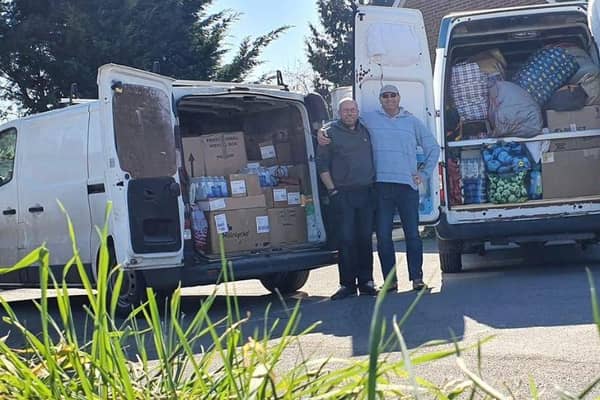 Paul Mann and Rupert Wright prepare to take donations to a refugee camp in Poland