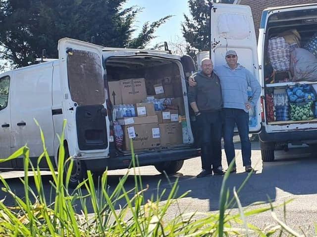 Paul Mann and Rupert Wright prepare to take donations to a refugee camp in Poland