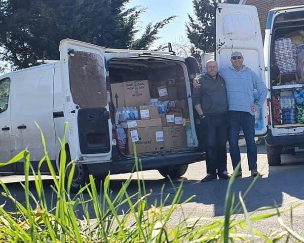 Paul Mann and Rupert Wright prepare to take donations to a refugee camp in Poland