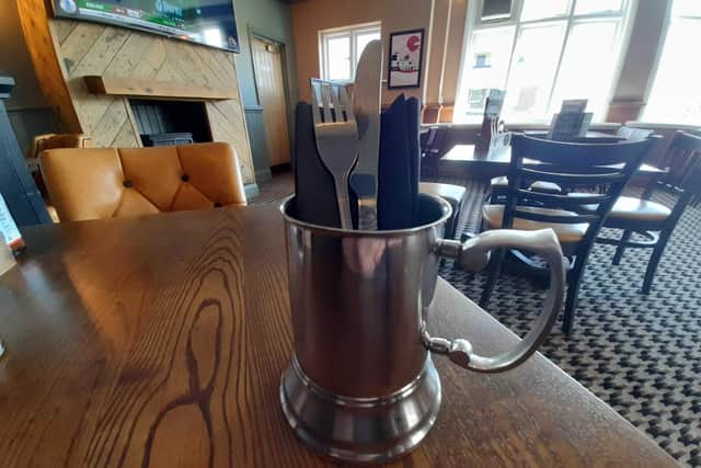 I've never seen cutlery served in a metal tankard before