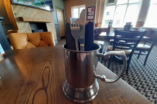 I've never seen cutlery served in a metal tankard before