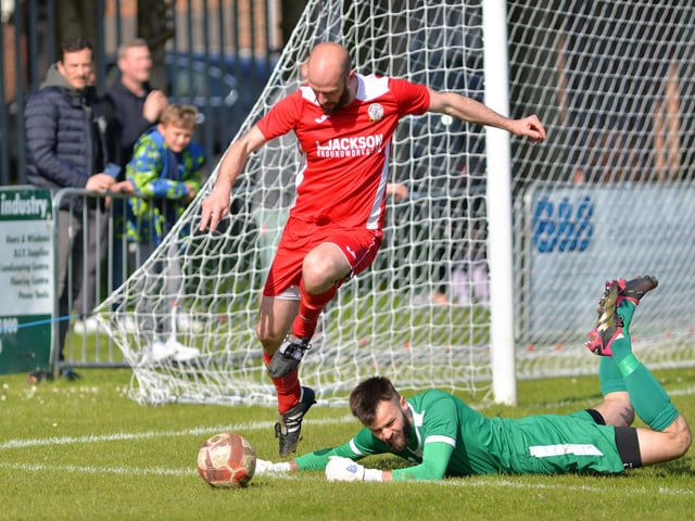 Horndean's Tom Jeffes and Bemerton keeper Patrick Creese. Picture by Martyn White