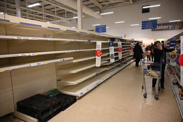 Empty shelves in a supermarket. Picture: OLI SCARFF/AFP via Getty Images