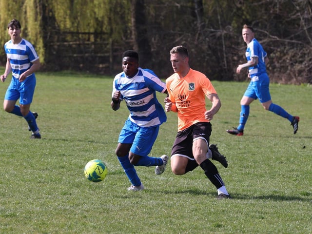 Action from the Buster Gordon Memorial Cup tie between AC Copnor (blue and white kit) and Seagull (orange and black kit). Picture: Sam Stephenson