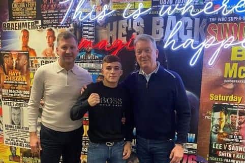 Fareham fighter Blu Bowers, centre, with promoter Frank Warren, right, alongside trainer and manager Wayne Batten