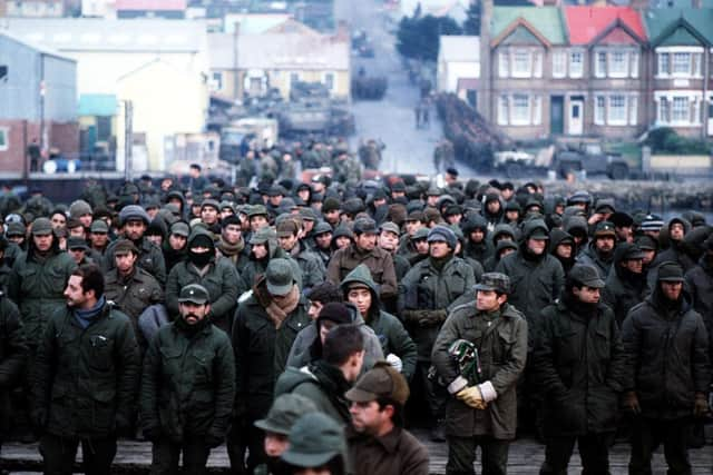 Argentine prisoners of war massed in Port Stanley, capital of the Falkland Islands, after their surrender to the British Falkland Islands Task Force. Photo: PA Wire.